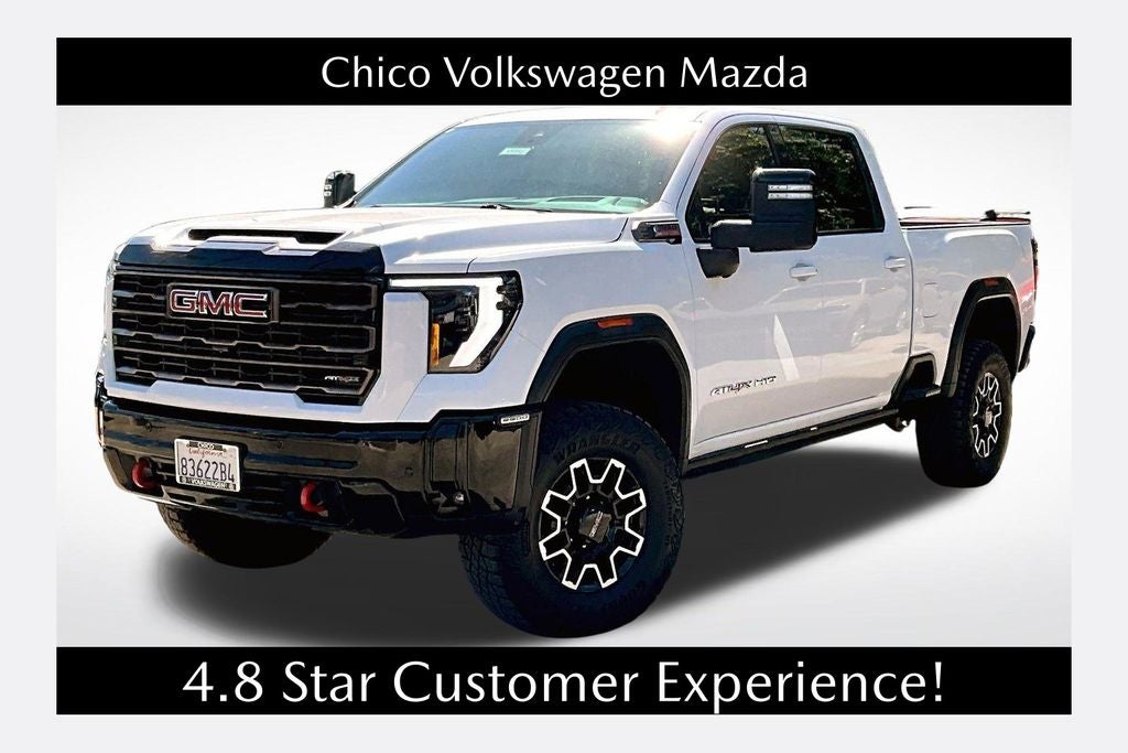 2025 GMC Sierra 2500HD AT4X in Summit White — front three-quarter view